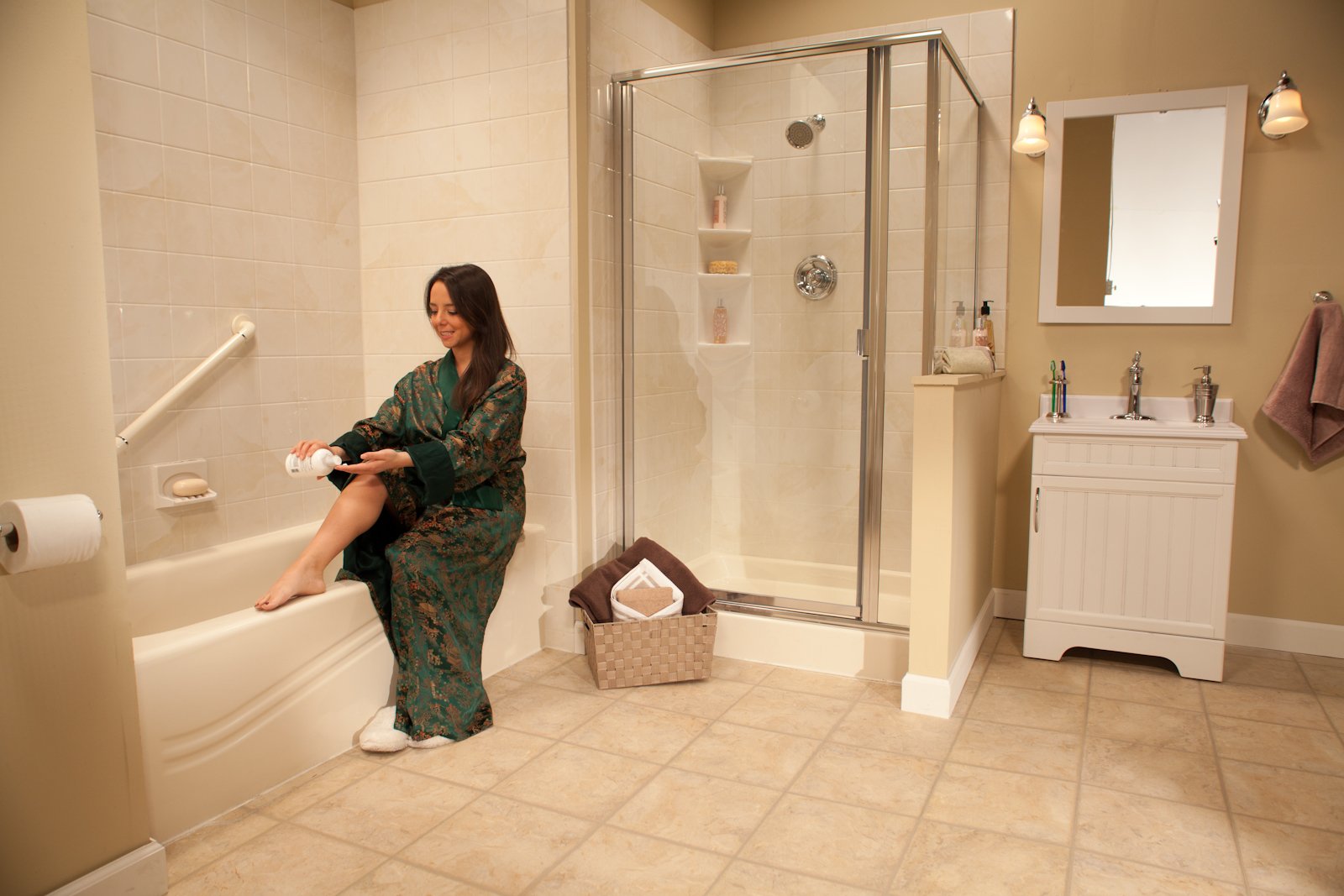 Young_Woman_Green_Robe_Applying_Lotion_on_Legs_Almond_Wave_Bathliner_6x6_Almond_White_Marble_Walls__IMG_4639_LR_bp